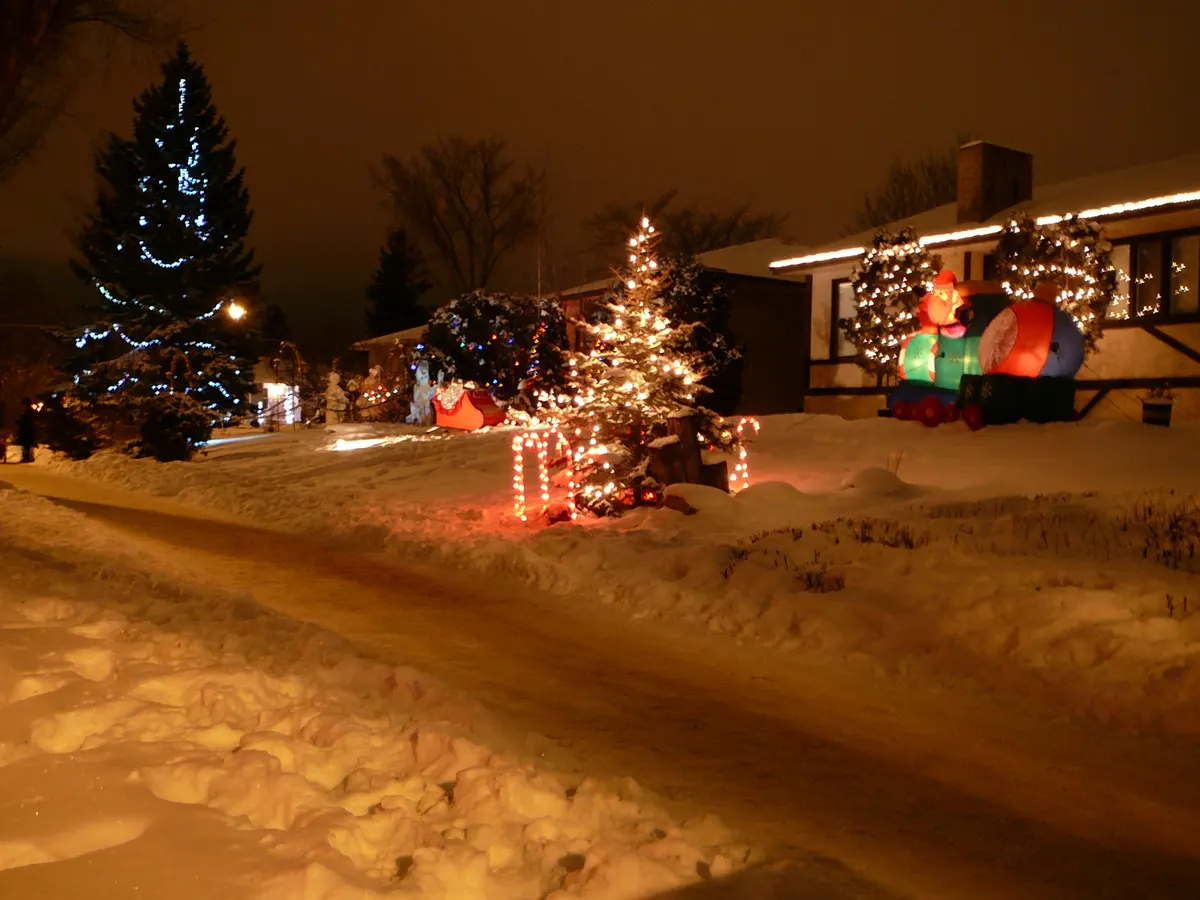 Candy Cane Lane in Edmonton's Crestwood neighbourhood: snowy street with lit trees and inflatable decorations