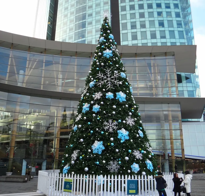 Large Christmas tree outside the glass facade of Surrey City Centre buildings