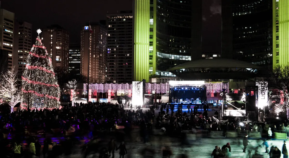 Cavalcade of Lights at Nathan Phillips Square in Toronto: lit Christmas tree and stage at night