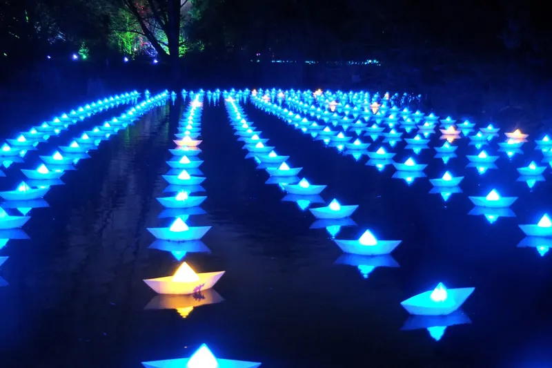 Glowing paper boats installation at Christmas at the Botanics