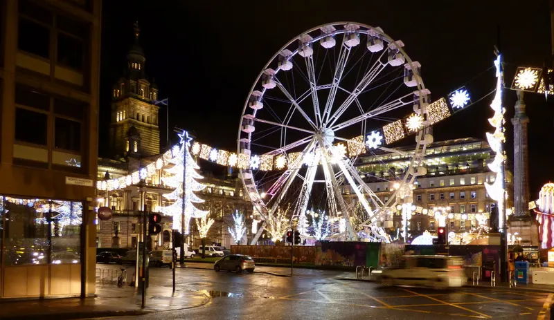 Lit-up big wheel and Christmas lights in Glasgow city centre at night