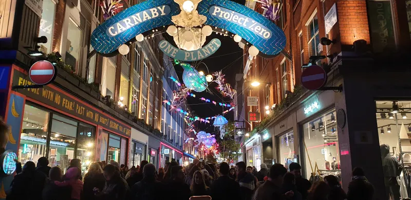 Crowd under the Carnaby Street Christmas lights
