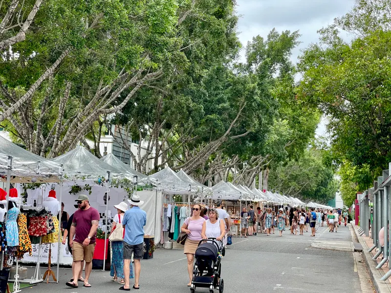 Families strolling past stalls at the Christmas market in South Brisbane