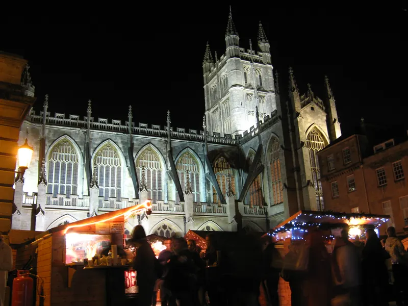 Christmas market chalets beside Bath Abbey