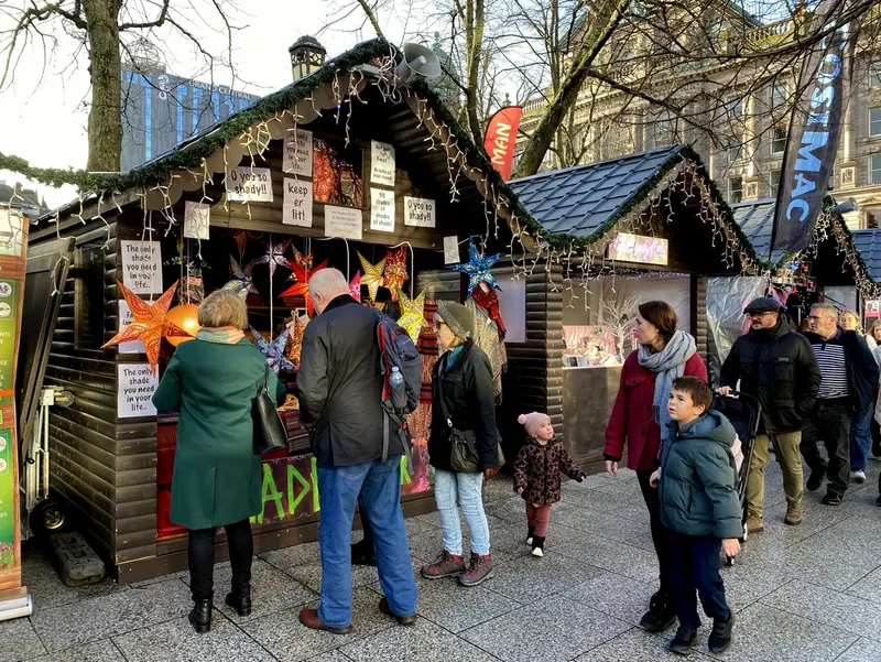 Families at a festive chalet at Belfast Continental Christmas Market