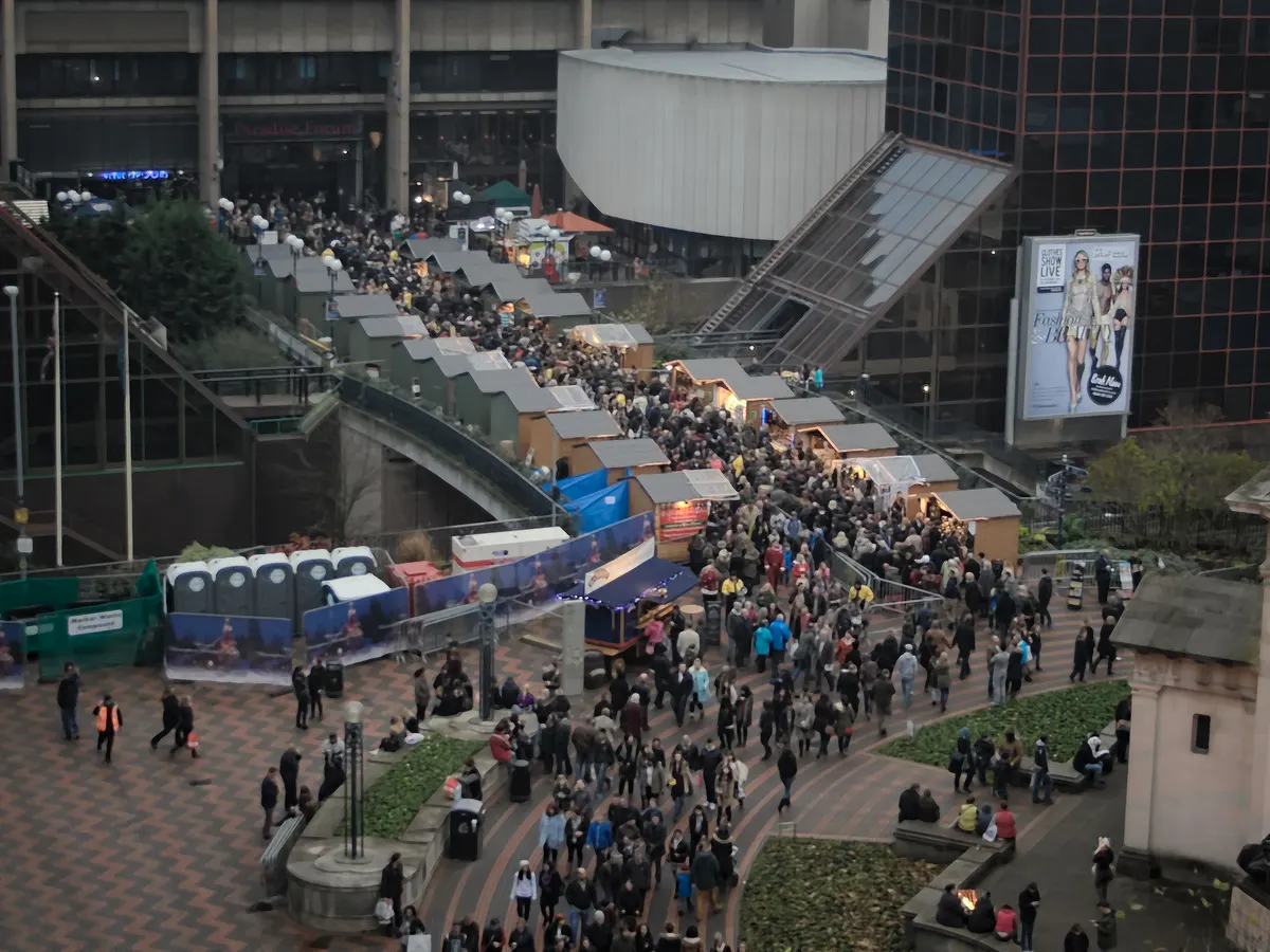 Aerial view of crowds along the Frankfurt Christmas Market stalls in Birmingham
