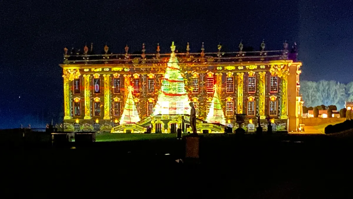 Chatsworth House lit up with Christmas projections at night