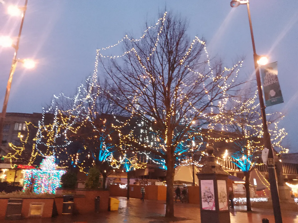 Trees covered in Christmas lights in Derby Market Place