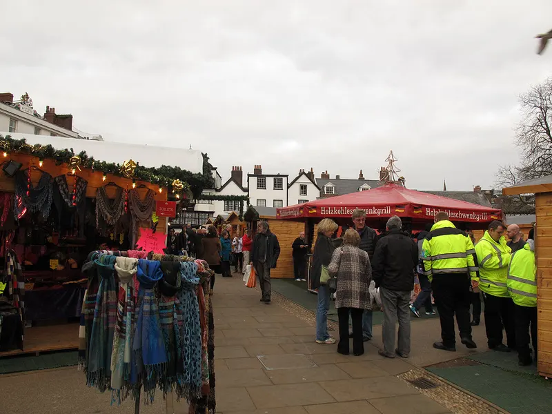 Stalls selling scarves and gifts at Exeter Christmas Market