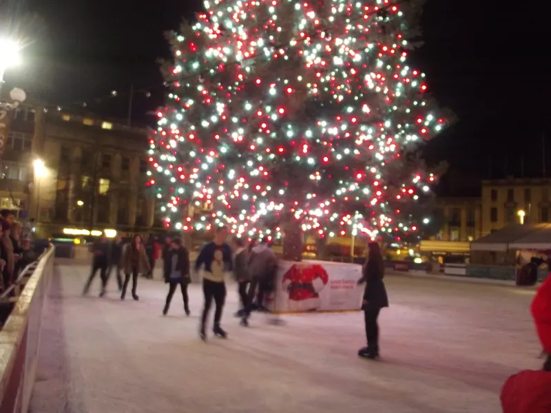 Ice rink beneath the lit Christmas tree at Nottingham Winter Wonderland