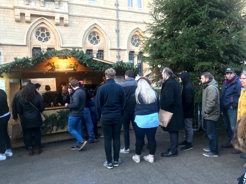 Queue at a festive wooden stall in Oxford