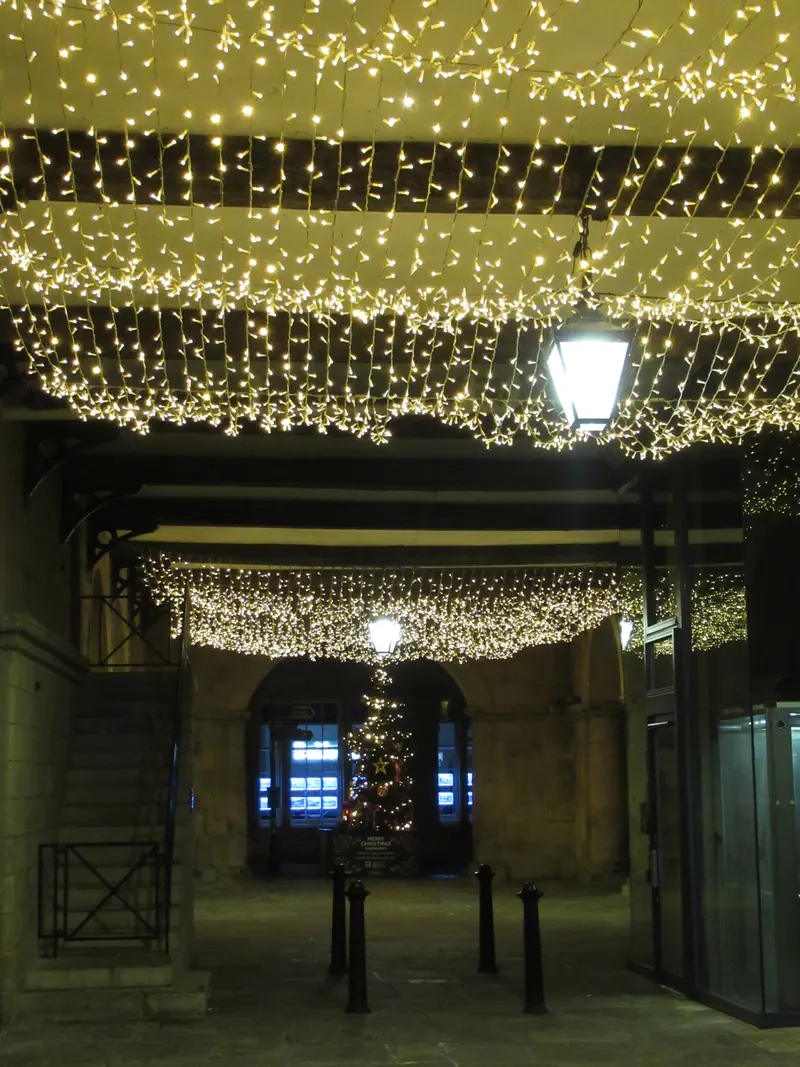 Fairy lights above a Shrewsbury arcade at Christmas