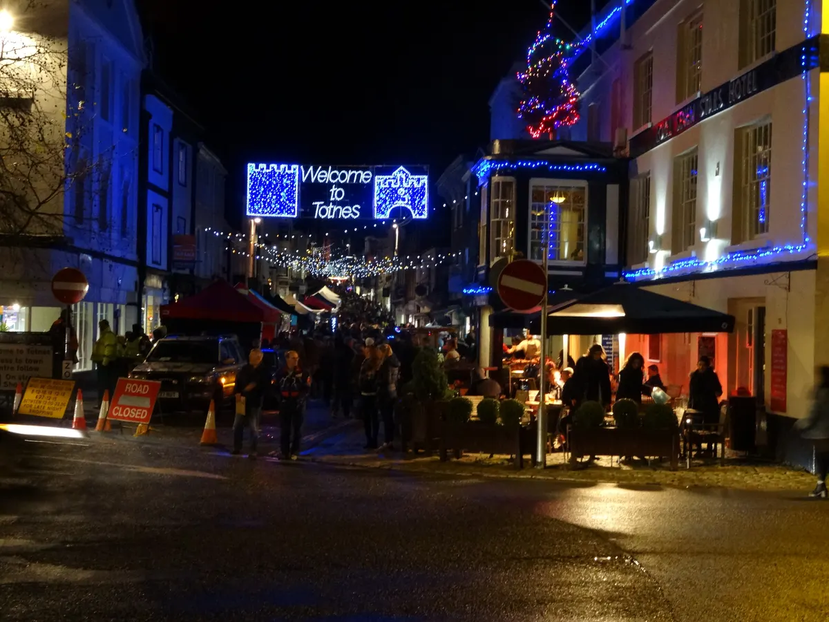 Welcome to Totnes Christmas lights over the high street at night