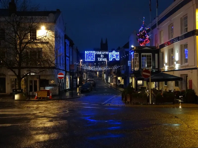 Totnes high street Christmas lights during late night shopping