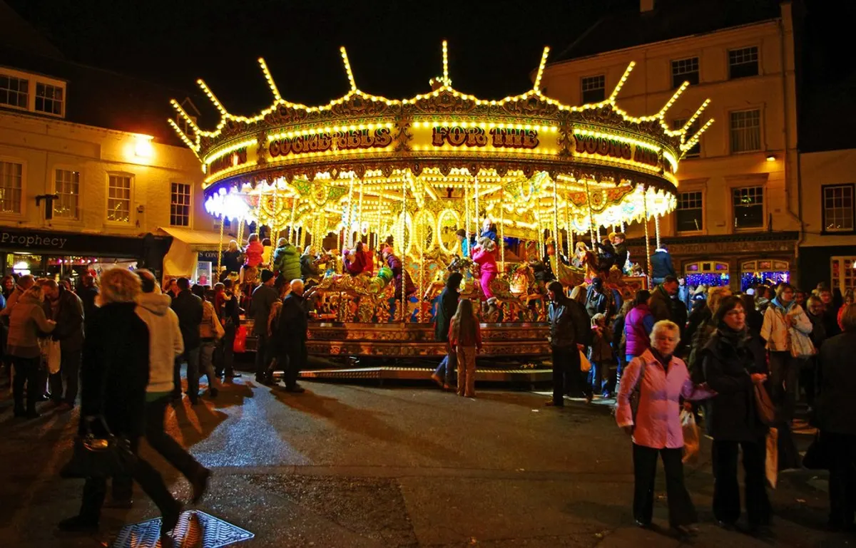 Carousel lit up at night at the Worcester Victorian Christmas Fayre