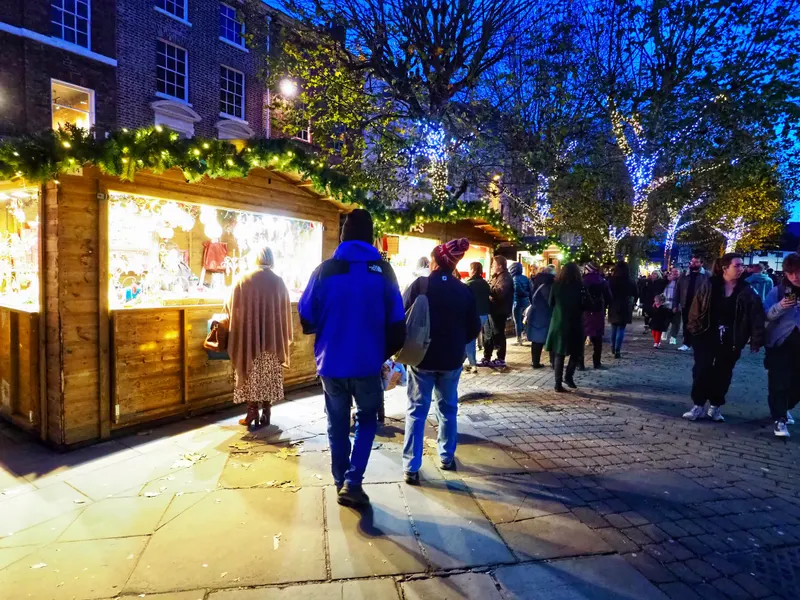 Wooden market chalet decorated with lights in York