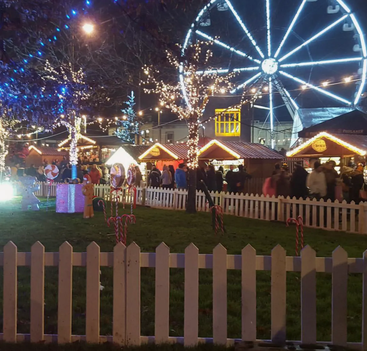 Wooden chalets, fairy lights and a big wheel at the Galway Christmas Market