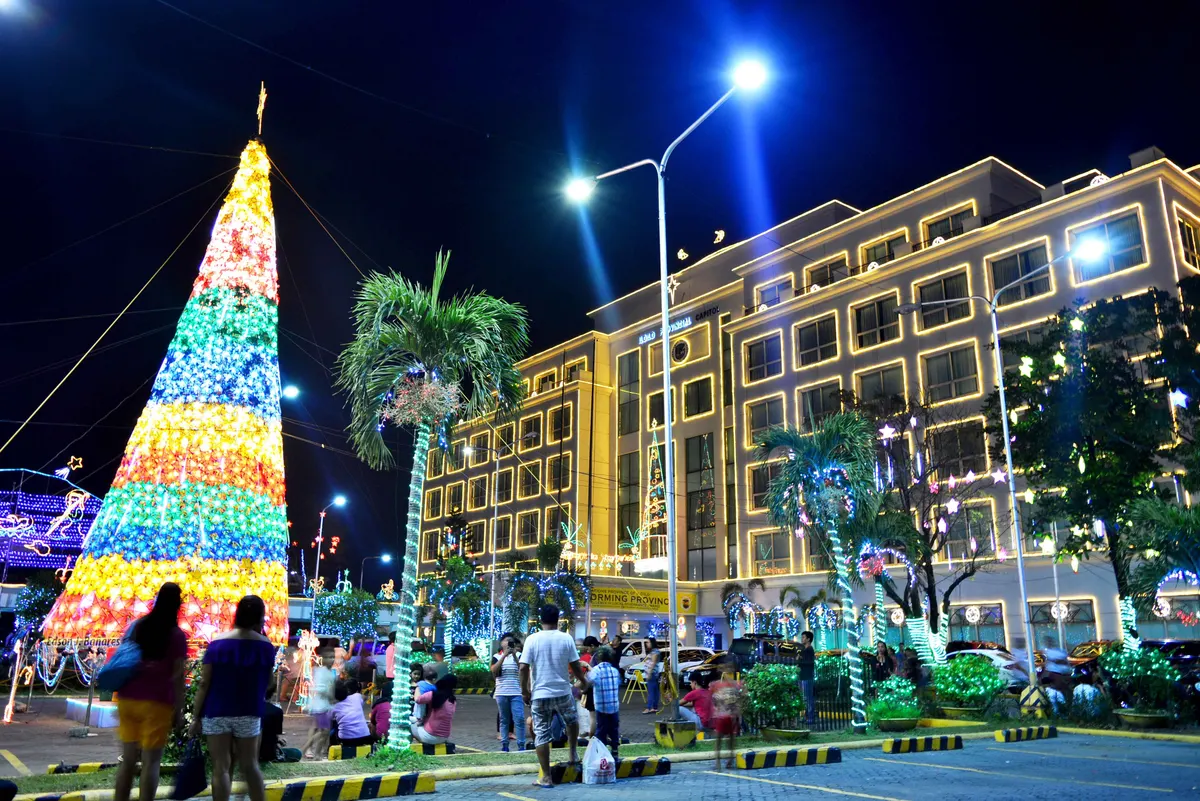 Colourful Christmas tree and lit Iloilo Provincial Capitol building at night
