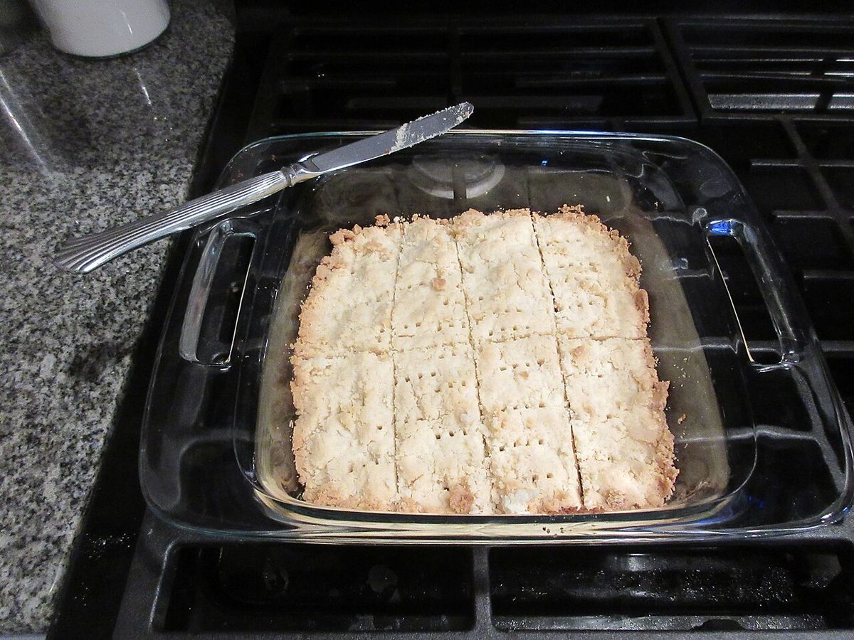 A pan of baked shortbread cut into bars
